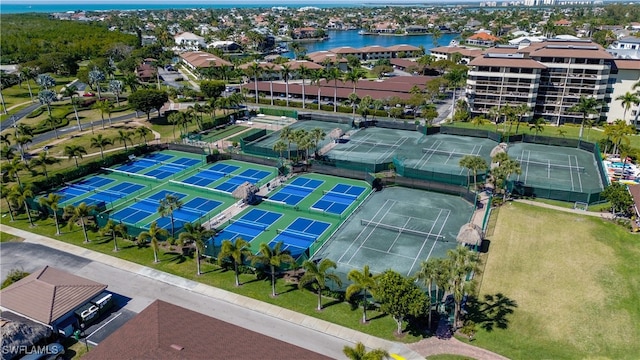 birds eye view of property with a water view