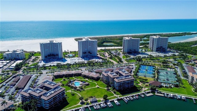 drone / aerial view featuring a view of the beach and a water view