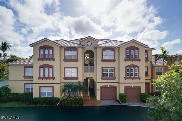 mediterranean / spanish-style home featuring a garage