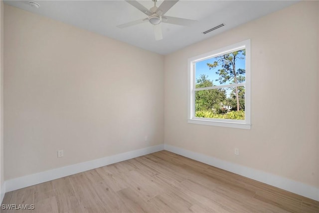 unfurnished room with ceiling fan and light wood-type flooring