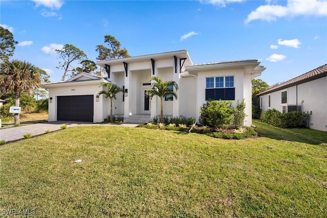 view of front facade with a garage and a front lawn