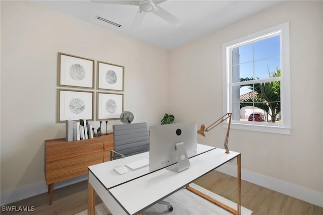 office space with hardwood / wood-style flooring and ceiling fan