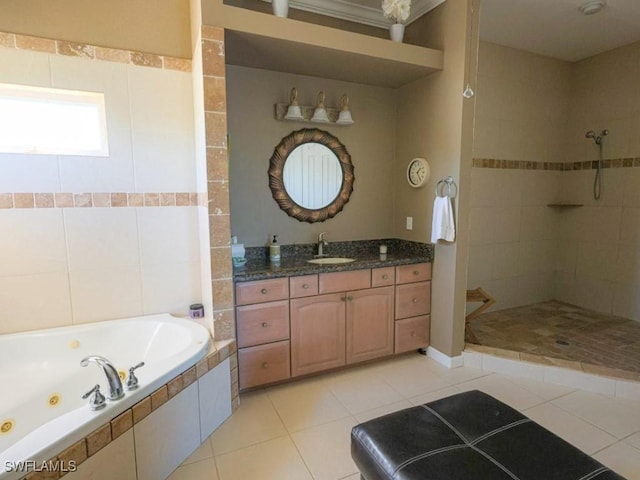 bathroom featuring tile patterned floors, separate shower and tub, and vanity