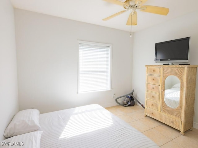 bedroom with tile patterned flooring, ceiling fan, and multiple windows