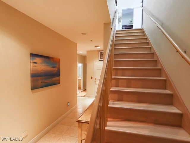 stairs featuring tile patterned flooring