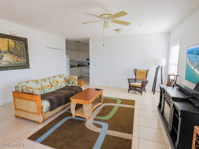 tiled living room with ceiling fan