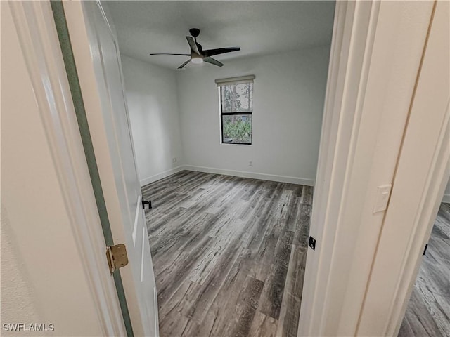 unfurnished room featuring hardwood / wood-style flooring and ceiling fan