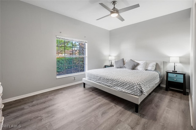 bedroom featuring ceiling fan and hardwood / wood-style flooring