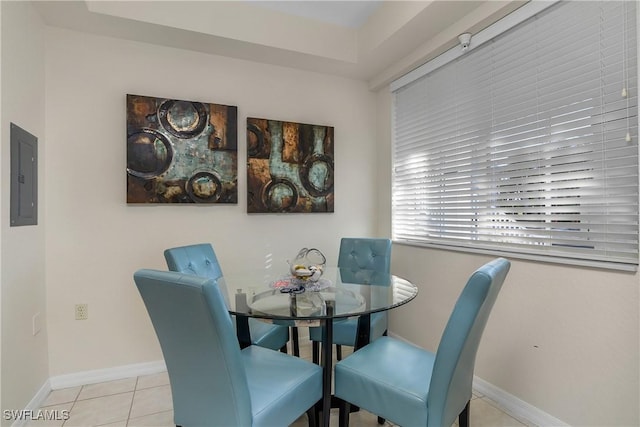 dining area featuring electric panel and light tile patterned floors