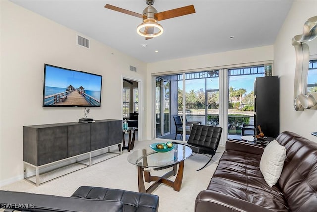 living room featuring ceiling fan and light carpet