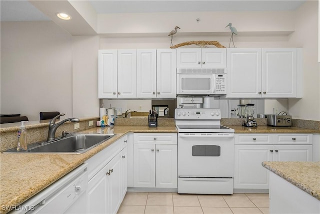 kitchen featuring white cabinets, white appliances, and sink