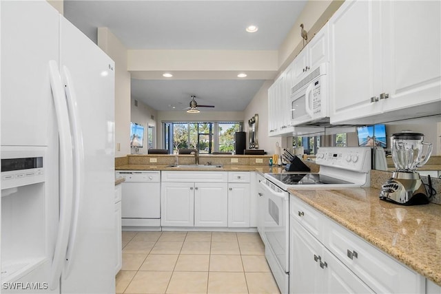 kitchen with white cabinets, ceiling fan, white appliances, and sink