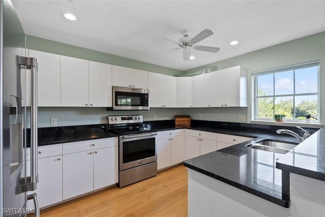 kitchen featuring sink, white cabinetry, and stainless steel appliances