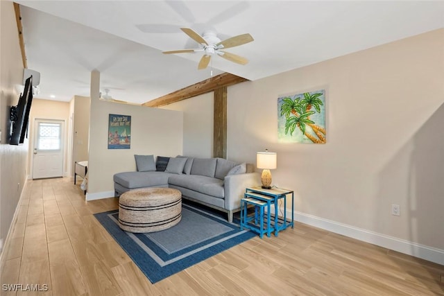 living room with light hardwood / wood-style floors and ceiling fan