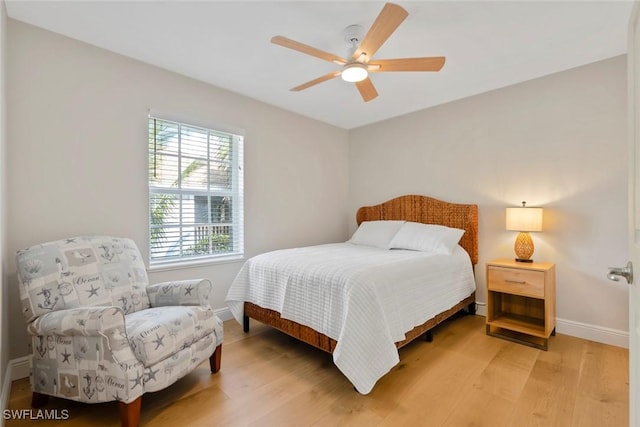 bedroom with hardwood / wood-style flooring and ceiling fan