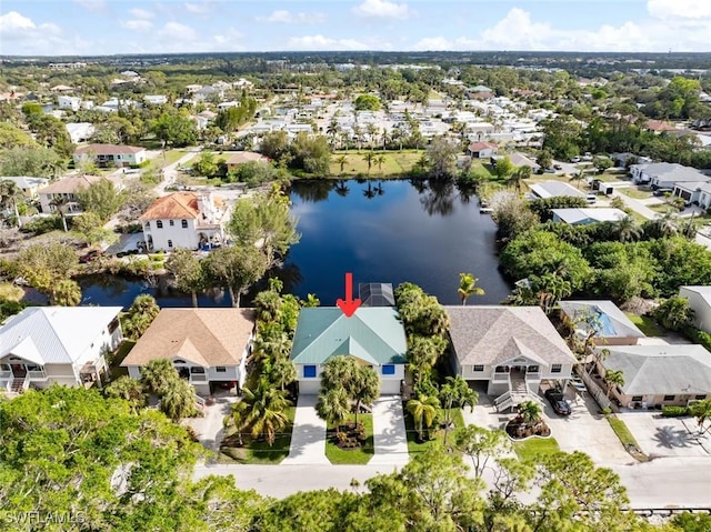 drone / aerial view with a water view