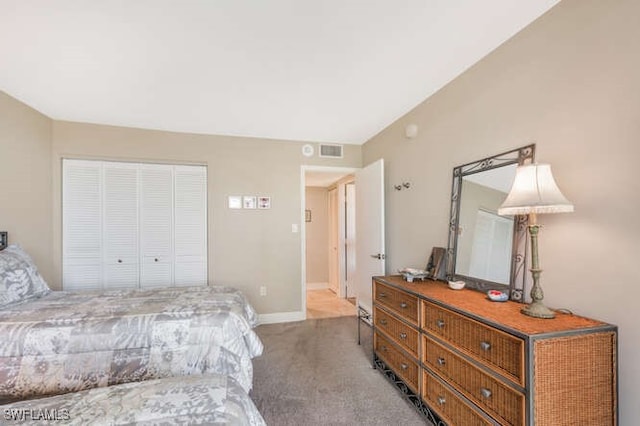 bedroom featuring a closet and carpet floors