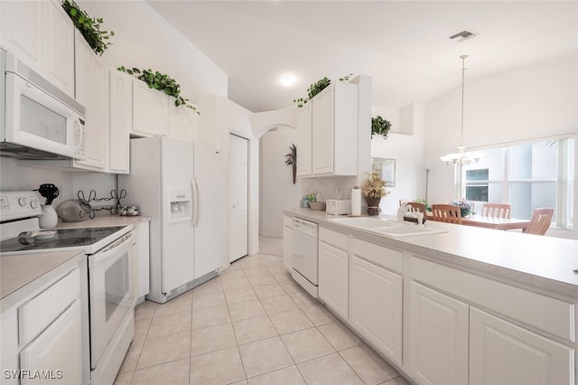 kitchen featuring white cabinetry, sink, hanging light fixtures, white appliances, and light tile patterned flooring