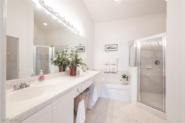 bathroom featuring vanity, tile patterned flooring, and plus walk in shower