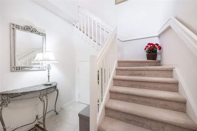 stairs with tile patterned floors