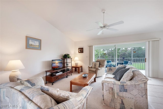 living room featuring ceiling fan, light colored carpet, and vaulted ceiling