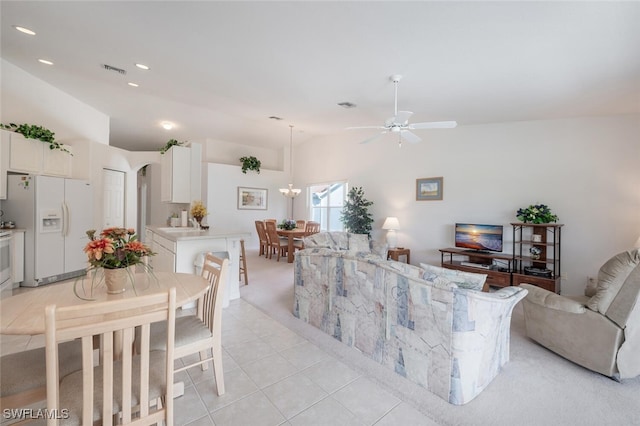 tiled living room with high vaulted ceiling and ceiling fan