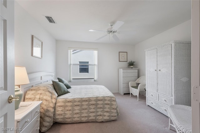 bedroom featuring ceiling fan and light carpet