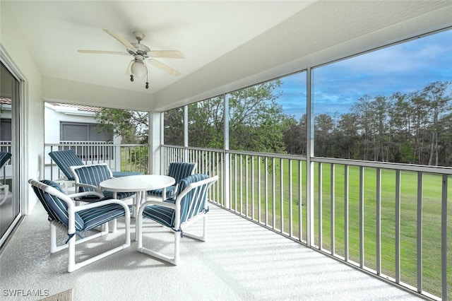 sunroom with ceiling fan and a wealth of natural light