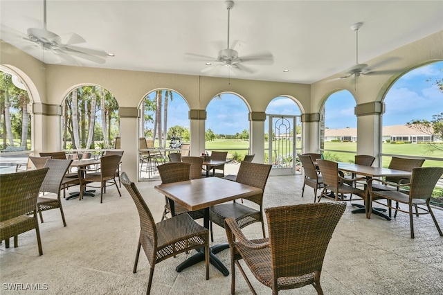 sunroom with plenty of natural light and ceiling fan