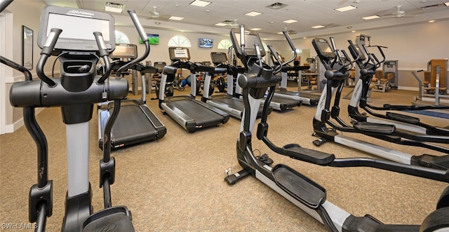 exercise room featuring carpet flooring and ceiling fan