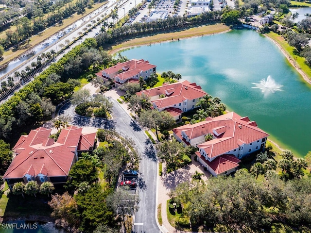 birds eye view of property featuring a water view