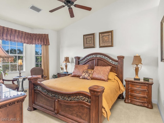 bedroom featuring ceiling fan, light colored carpet, and lofted ceiling