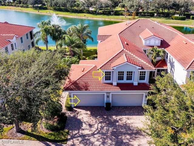 birds eye view of property featuring a water view