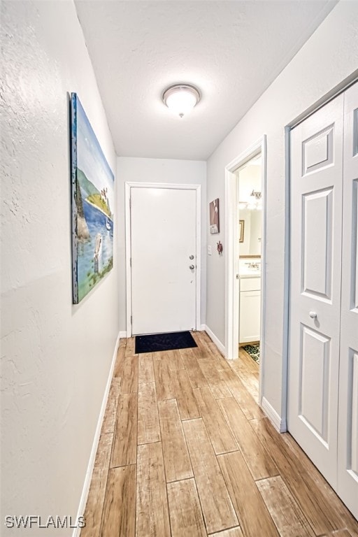 doorway to outside featuring light hardwood / wood-style flooring