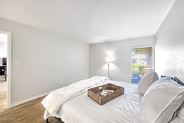 bedroom featuring hardwood / wood-style floors