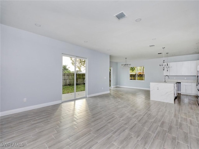 unfurnished living room featuring light hardwood / wood-style floors