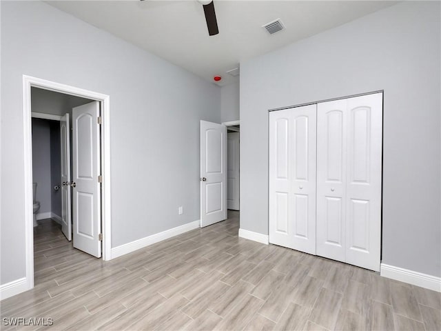 unfurnished bedroom with ceiling fan, light hardwood / wood-style floors, and a closet