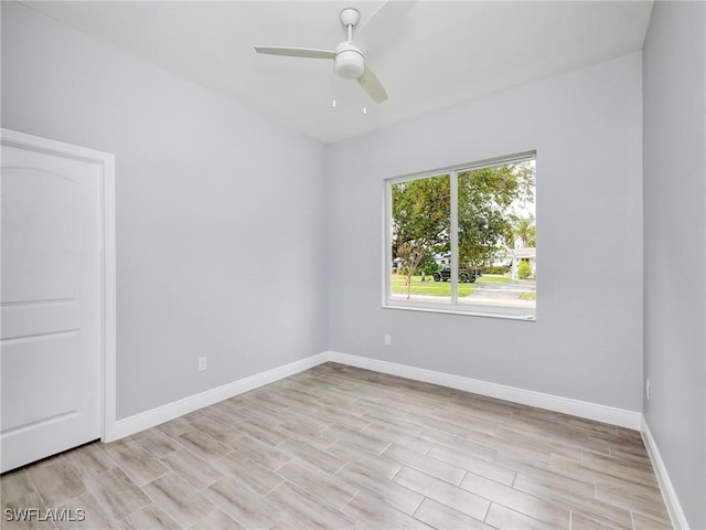 spare room with ceiling fan and light hardwood / wood-style floors