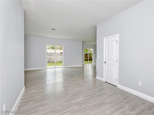 spare room with light hardwood / wood-style floors