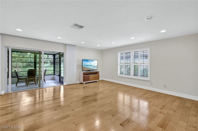 unfurnished living room with light wood-type flooring