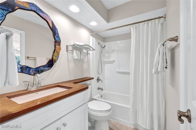 full bathroom with shower / tub combo, vanity, and toilet