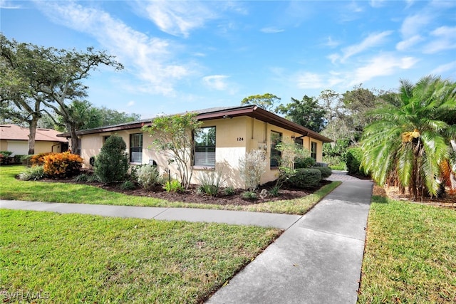 ranch-style house with a front lawn