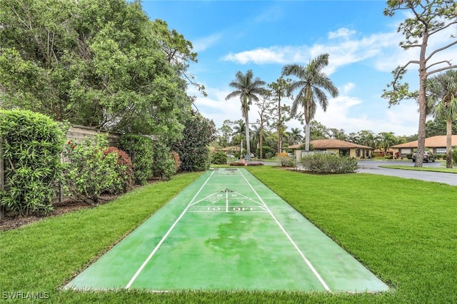 view of property's community featuring a yard