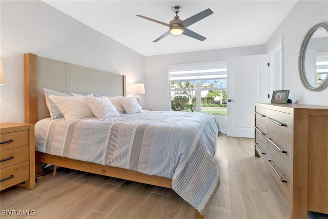 bedroom featuring light wood-type flooring and ceiling fan