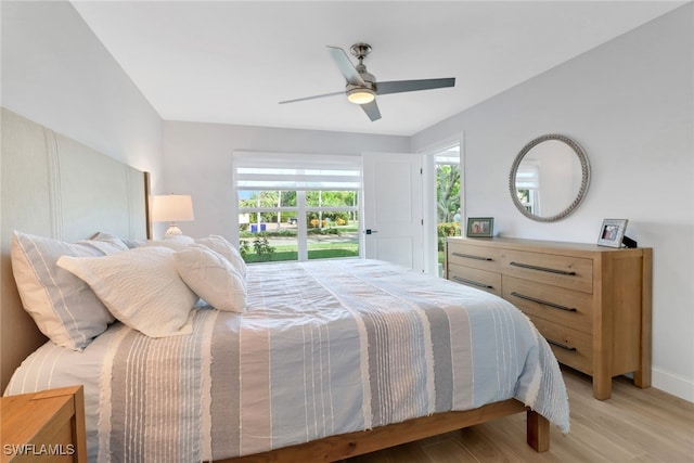 bedroom with ceiling fan and light hardwood / wood-style floors