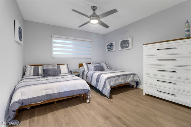 bedroom featuring ceiling fan and light hardwood / wood-style floors