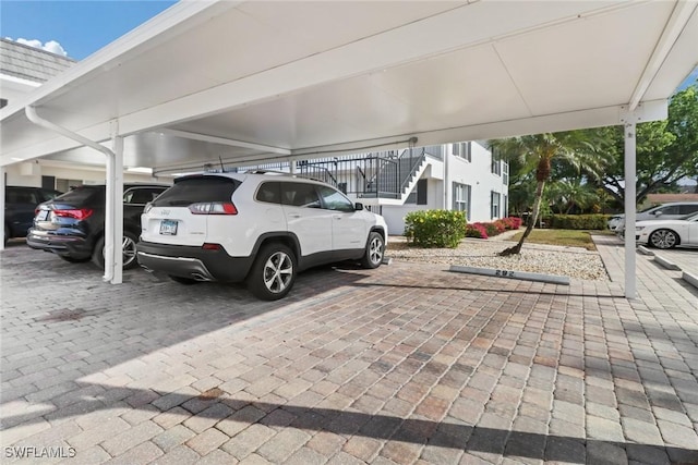 view of vehicle parking featuring a carport