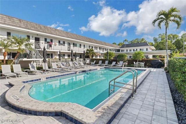 view of swimming pool featuring a patio area