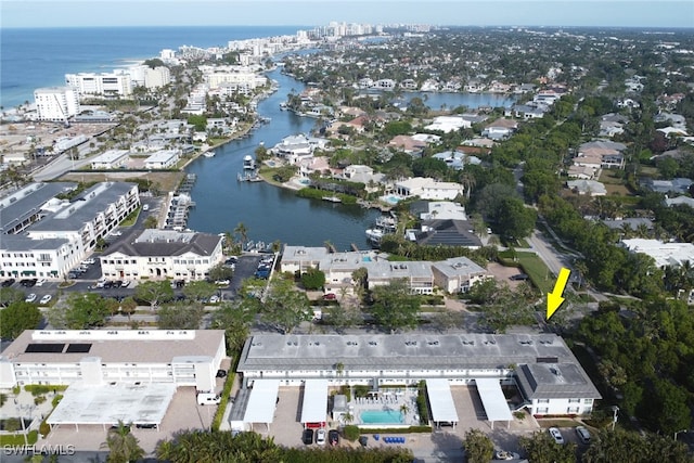 birds eye view of property with a water view