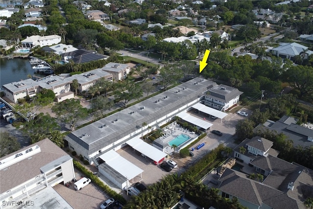 birds eye view of property with a water view